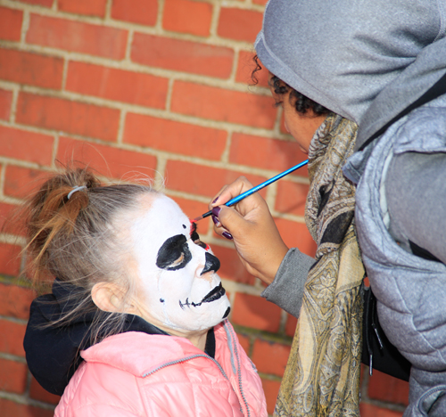 Getting ready for the Skulls and Skeletons procession on Day of the Dead in Cleveland