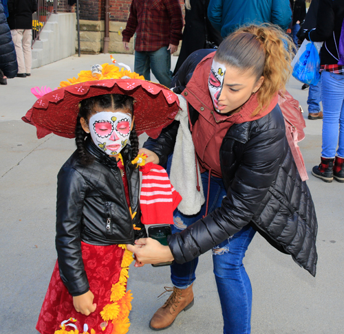 Getting ready for the Skulls and Skeletons procession on Day of the Dead in Cleveland