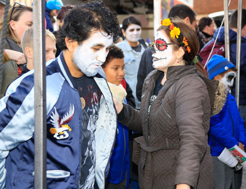 Getting ready for the Skulls and Skeletons procession on Day of the Dead in Cleveland