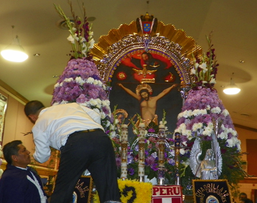 Preparing the icon of the Lord of the Miracles for the Procession