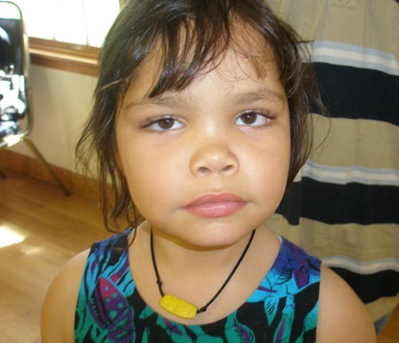 Girl wearing a Palauan money necklace