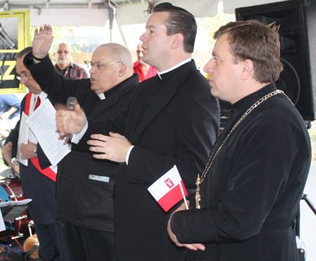 Rev. Roman Misiewicz, Rev. Eric Orzech and Very Rev. Bohdan Zhoba join in a Benediction prayer to end the Polish Constitution Day