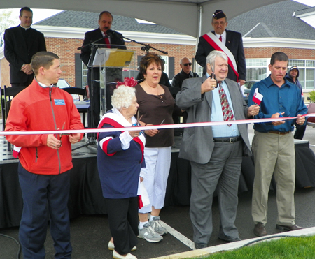 Cutting the ribbon to open Polish Village in Parma