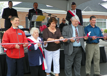 Cutting the ribbon to open Polish Village in Parma