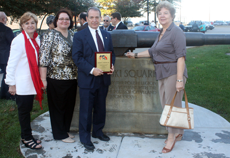 Joseph A. Drobot, Jr. with plaque at Pulaski cannon