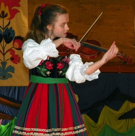 Piast girl playing Obertas Op.19 on violin