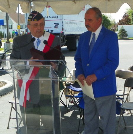 Francis Rutkowski thanked MC Bruce Kalinowski after the parade