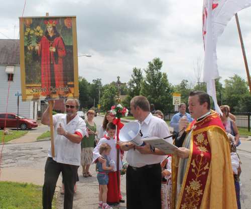 Fr Orzech blesses the St Casimir Way street sign