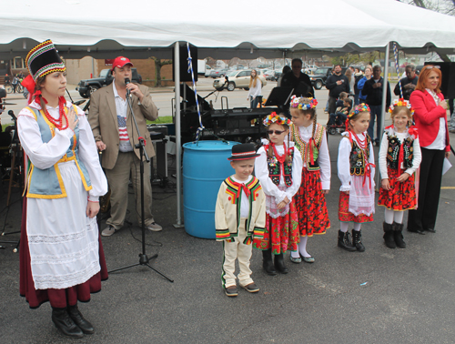  Elizabeth Suhak of the PIAST Dance Ensemble sings the Polish national anthem