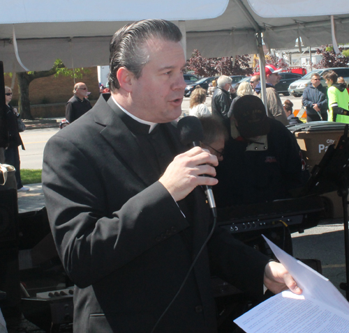 Father Eric Orzech gives the invocation