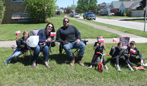 Family watching Polish Parade in Parma