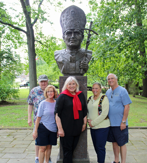 Posing with the newly installed bust of Saint John Paul II