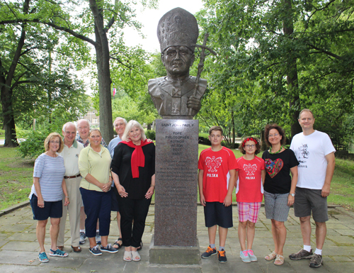 Posing with the newly installed bust of Saint John Paul II