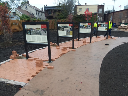 Laying bricks in new Polish Heritage Garden in Cleveland