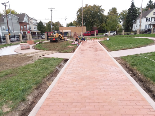 Laying bricks in new Polish Heritage Garden in Cleveland