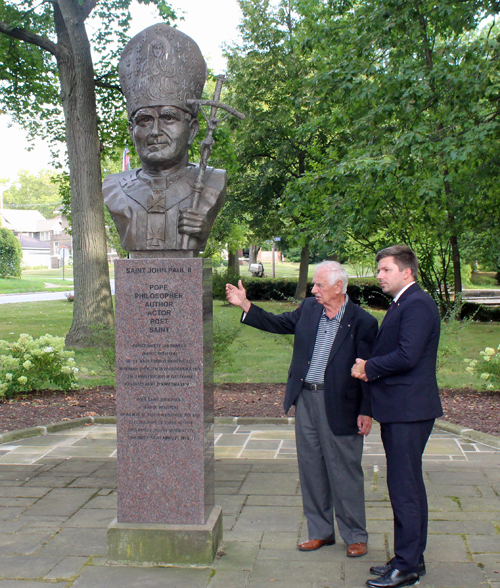 Gene Bak explains the new Saint John Paul II bust to Consul General Adrian Kubicki