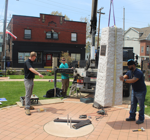 Placing the new monument in the Polish Heritage Garden