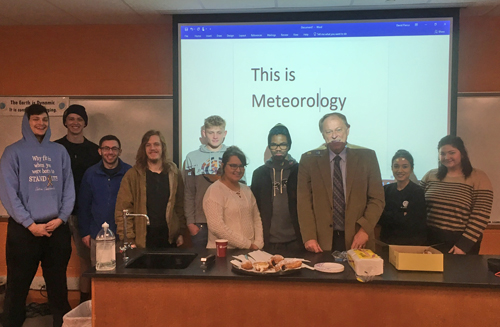 John Niedzialek with packzi and students distributing at Lakeland College