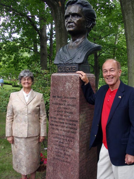 Judge Diane Karpinski and Ben Steffanski with the newly dedicated bust of Madame Curie