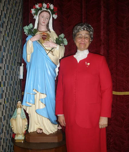 Judge Diane Karpinski with statue form 1st St. Casimir Church
