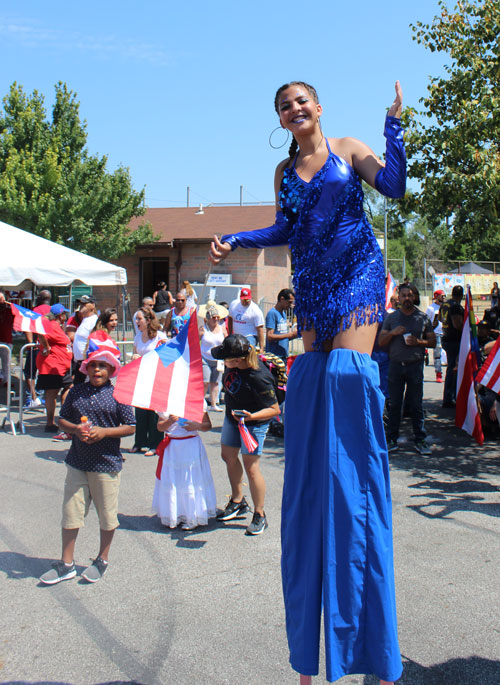 Girl on stilts at 2019 Puerto Rican Festival in Cleveland