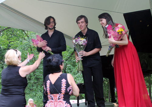 Arseny Tarasevich-Nikolaev, Dmitry Tyurin and Nara Avetisyan receiving flowers
