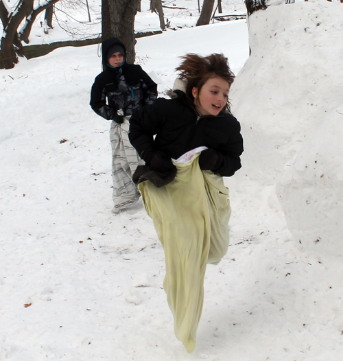 Sack race around Snow fort at Maslenitsa celebration in Cleveland Russian Cultural Garden