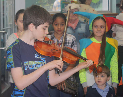 Boy playing violin at Maslenitsa
