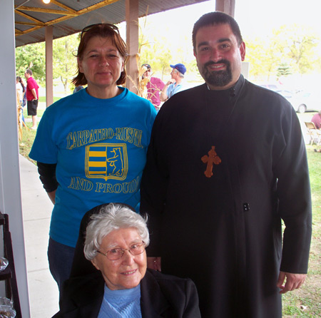Sr. Mary John Femun (sitting)  Becky Prest and Fr. Andrew Deskevich