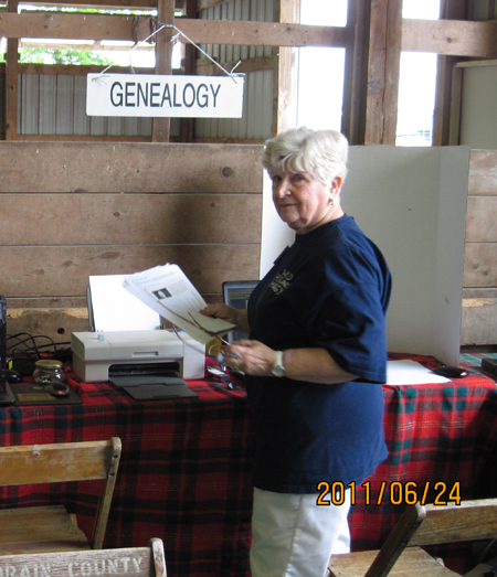 Scottish American Society leader Margaret Frost assisitng with geneaology
