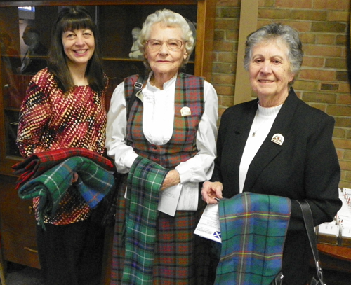 Jean Duncan with Duncan and Grant Tartan, Karen MacDonald with MacDonald tartan. Elizabeth DeFrancesco, Carmichael tartan