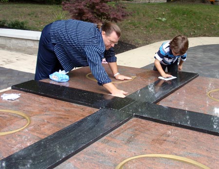 Milan Damljanovic and his son do some last minute cleaning