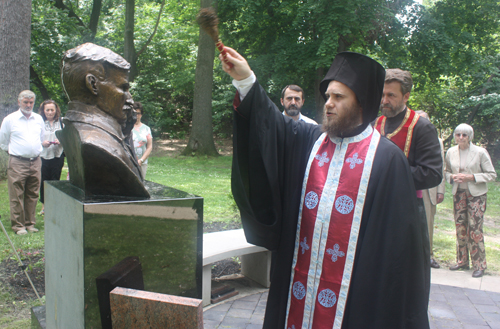 Rev. Zivojin Jakovljevic and Hieromonk Platon bless the Tesla statue