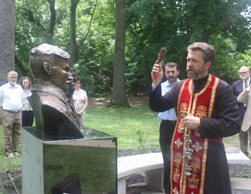 Rev. Zivojin Jakovljevic and Hieromonk Platon bless the Tesla statue