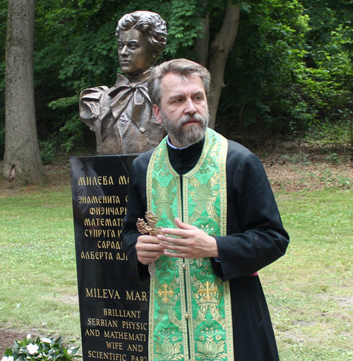 Rev. Zivojin Jakovljevic blesses new bust of Mileva Maric in Serbian Cultural Garden in Cleveland