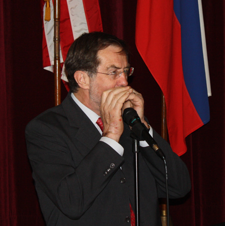 Lozje Peterle playing harmonica