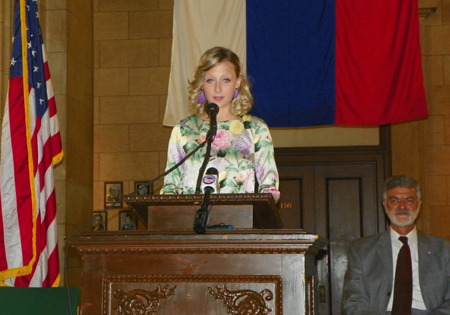 Nika Zmauc, daughter of the Slovenian Consul General, at podium