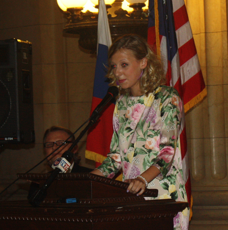 Nika Zmauc, daughter of the Slovenian Consul General, at podium