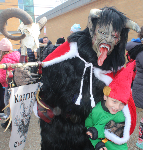 Krampus with boy at Kurentovanje