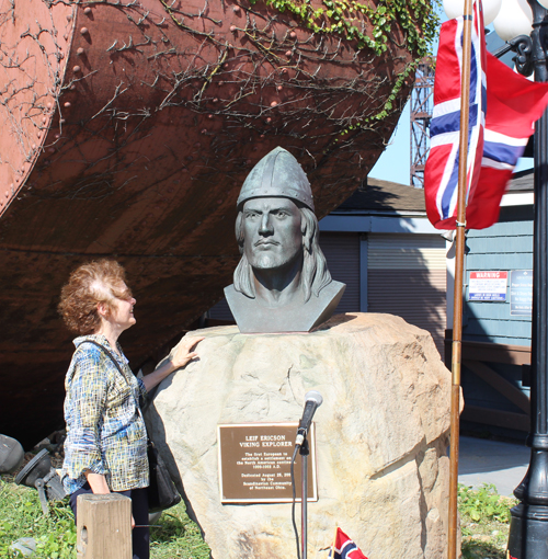 Posing for photos with the Leif Erikson bust