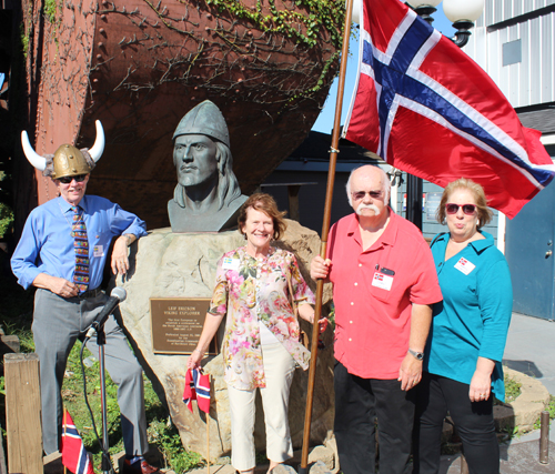 Posing for photos with the Leif Erikson bust