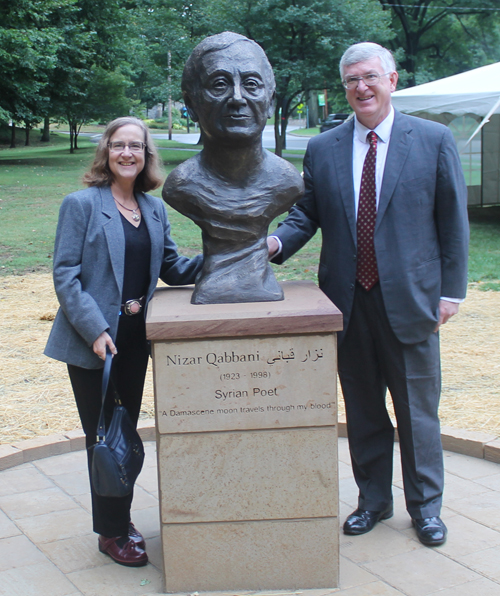 Posing with the statue of the Syrian poet Nizar Qabbani in the Syrian Cultural Garden in Cleveland