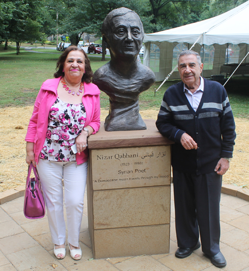 Posing with the statue of the Syrian poet Nizar Qabbani in the Syrian Cultural Garden in Cleveland