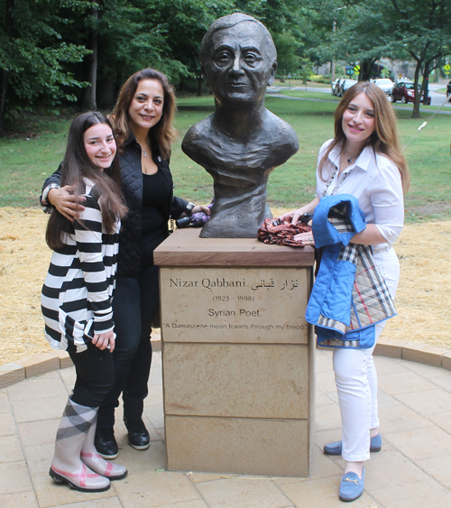 Posing with the statue of the Syrian poet Nizar Qabbani in the Syrian Cultural Garden in Cleveland