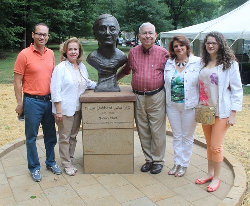 Posing with the statue of the Syrian poet Nizar Qabbani in the Syrian Cultural Garden in Cleveland