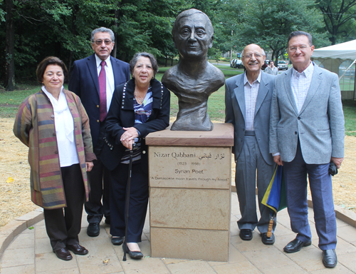 Posing with the statue of the Syrian poet Nizar Qabbani in the Syrian Cultural Garden in Cleveland