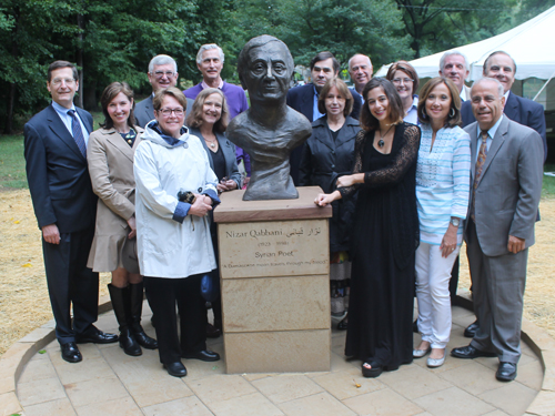 CCWA - Posing with the statue of the Syrian poet Nizar Qabbani in the Syrian Cultural Garden in Cleveland
