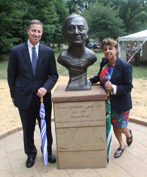 David Fleshler Posing with the statue of the Syrian poet Nizar Qabbani in the Syrian Cultural Garden in Cleveland