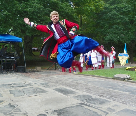 Young man of Kashtan Ukrainian Dancers  leaps high