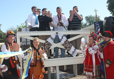 Congressman Dennis Kucinich, Ohio State Representative Tim DeGeeter, Ihor Diaczyn and Roman Fedkiw assisted Parma Mayor Dean DePiero in cutting the ribbon to officially open the new Ukrainian Heritage Park in Parma. 